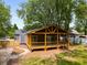 Charming home featuring a covered porch, wood accents, and a cozy outdoor space at 638 Medford Se Pl, Smyrna, GA 30080