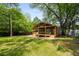 Charming home featuring a covered porch, wood accents, complemented by a landscaped yard at 638 Medford Se Pl, Smyrna, GA 30080