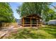 Charming home with a covered porch and wood accents, complemented by a neatly landscaped yard at 638 Medford Se Pl, Smyrna, GA 30080