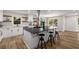 Bright kitchen features a large island, stainless steel appliances, white cabinetry, and modern finishes at 638 Medford Se Pl, Smyrna, GA 30080