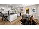 Modern kitchen featuring a large island, stainless steel appliances, and a seamless transition to the dining area at 638 Medford Se Pl, Smyrna, GA 30080