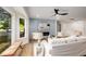 Sunlit living room features a shiplap accent wall, modern fireplace, and large bay window overlooking the yard at 638 Medford Se Pl, Smyrna, GA 30080