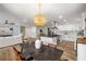 Open concept living with kitchen, dining, and living areas, with a modern chandelier at 638 Medford Se Pl, Smyrna, GA 30080