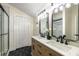 This main bathroom features double sinks, a large shower, and lots of storage at 638 Medford Se Pl, Smyrna, GA 30080