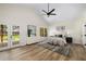 This main bedroom has a ceiling fan, closet, and French doors leading to the backyard at 638 Medford Se Pl, Smyrna, GA 30080