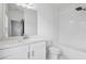 Well-lit bathroom with white vanity, subway tile shower, and modern fixtures at 808 Angora Aly, Scottdale, GA 30079