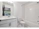 Bright bathroom featuring a tub and shower combo, modern fixtures, and classic tilework at 808 Angora Aly, Scottdale, GA 30079