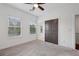 Bright bedroom with two windows, ceiling fan, and closet at 808 Angora Aly, Scottdale, GA 30079