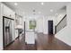 A beautifully staged kitchen featuring stainless steel appliances and an island at 808 Angora Aly, Scottdale, GA 30079
