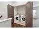 Interior shot of the laundry room with modern appliances at 808 Angora Aly, Scottdale, GA 30079