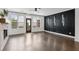 A bright living room with dark wood floors, a fireplace, and access to the backyard at 808 Angora Aly, Scottdale, GA 30079