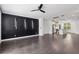 Spacious living room with dark wood flooring and decorative accent wall at 808 Angora Aly, Scottdale, GA 30079