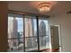 Balcony showcasing floor to ceiling windows with views of the cityscape and a chandelier at 1080 Peachtree Ne St # 2915, Atlanta, GA 30309