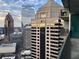 An urban view from the building's balcony showcases a captivating perspective of city skyline and modern architecture at 1080 Peachtree Ne St # 2915, Atlanta, GA 30309