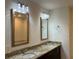 Bathroom featuring dual sinks, granite countertops, and modern lighting fixtures at 1080 Peachtree Ne St # 2915, Atlanta, GA 30309
