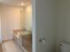 Bathroom featuring a soaking tub, tiled shower, and modern fixtures at 1080 Peachtree Ne St # 2915, Atlanta, GA 30309