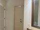 Bathroom area with door and partially seen mirror above sink at 1080 Peachtree Ne St # 2915, Atlanta, GA 30309