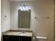 Bathroom featuring a granite countertop vanity and a modern mirror and lighting at 1080 Peachtree Ne St # 2915, Atlanta, GA 30309