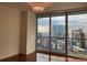 Bedroom featuring floor-to-ceiling windows offering city views at 1080 Peachtree Ne St # 2915, Atlanta, GA 30309