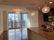 Open-concept living area with stunning city views, modern lighting, and hardwood floors at 1080 Peachtree Ne St # 2915, Atlanta, GA 30309
