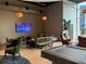 Spacious resident lounge with a variety of seating, a large window, and stylish lighting at 1080 Peachtree Ne St # 2915, Atlanta, GA 30309