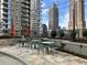 Inviting rooftop patio furnished with outdoor seating and lush landscaping at 1080 Peachtree Ne St # 2915, Atlanta, GA 30309