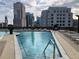 Beautiful rooftop pool with inviting lounge chairs and stunning city views at 1080 Peachtree Ne St # 2915, Atlanta, GA 30309