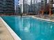 Inviting swimming pool with lounge seating and scenic views of surrounding buildings at 1080 Peachtree Ne St # 2915, Atlanta, GA 30309