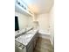 Modern bathroom features granite countertops, dual sinks, and a soaking tub at 1700 Devon Sw Dr, Atlanta, GA 30311