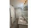 Bathroom featuring double sinks with granite counters, wood look floors and shower at 1700 Devon Sw Dr, Atlanta, GA 30311