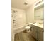 Bathroom features shower-tub combo, new toilet and vanity at 1700 Devon Sw Dr, Atlanta, GA 30311