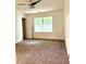 Bedroom features carpeted floor, ceiling fan and natural light at 1700 Devon Sw Dr, Atlanta, GA 30311