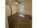 Bedroom featuring ceiling fan, plush carpet, and window at 1700 Devon Sw Dr, Atlanta, GA 30311