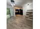 Dining room featuring sliding glass door, wood-look floors, and open to the kitchen at 1700 Devon Sw Dr, Atlanta, GA 30311