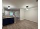 Dining room featuring wood-look floors, and open to the kitchen at 1700 Devon Sw Dr, Atlanta, GA 30311