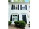 Charming home featuring a white exterior, black shutters, and a well-maintained front yard at 1700 Devon Sw Dr, Atlanta, GA 30311
