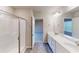 Bathroom featuring double vanity, shower with glass doors and neutral decor at 3 Roving Hills Cir, Cartersville, GA 30121