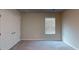 Neutral bedroom with a carpeted floor, standard window with blinds, and a closet with white paneled doors at 3 Roving Hills Cir, Cartersville, GA 30121