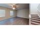 Bright living room with hardwood floors, stairs to second floor, and natural light at 3 Roving Hills Cir, Cartersville, GA 30121