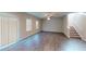 Bright living room with hardwood floors, stairs to second floor, and natural light at 3 Roving Hills Cir, Cartersville, GA 30121