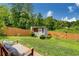 View of backyard featuring a lawn, storage shed, and privacy fence at 445 Brownell Ave, Scottdale, GA 30079