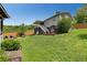 Backyard featuring a lawn and a fire pit with seating, perfect for enjoying outdoor living at 445 Brownell Ave, Scottdale, GA 30079