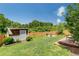 A spacious backyard with a shed and a fire pit area, perfect for outdoor entertaining at 445 Brownell Ave, Scottdale, GA 30079
