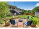 Backyard featuring a firepit with seating, a hammock and a multi-level deck and patio at 445 Brownell Ave, Scottdale, GA 30079