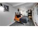 Cozy basement bedroom with tiled floors, unique decor, and an orange and gray color scheme at 445 Brownell Ave, Scottdale, GA 30079