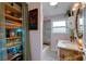 Charming bathroom with shelving, tub and shower, and a patterned vanity at 445 Brownell Ave, Scottdale, GA 30079
