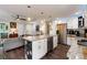 Open kitchen featuring stainless appliances, granite countertops, and an island with floral accents at 445 Brownell Ave, Scottdale, GA 30079