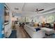 Bright and airy living room with an open-concept design, flowing into the kitchen at 445 Brownell Ave, Scottdale, GA 30079