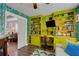 Unique office area featuring custom shelves, desk space and a comfortable seating area at 445 Brownell Ave, Scottdale, GA 30079
