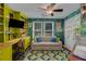 Bright, eclectic office space with built-in shelves, colorful wallpaper, and ample natural light at 445 Brownell Ave, Scottdale, GA 30079